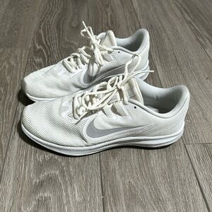 Nike Women’s running shoe.  Downshifter.  Size 9.  White with light gray swoosh.